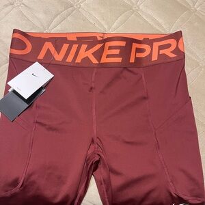 Nike Pro Dri-FIT Leggings in Maroon and Orange